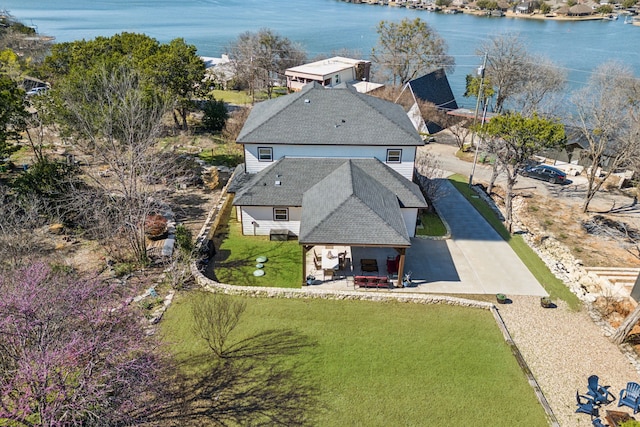 birds eye view of property with a water view