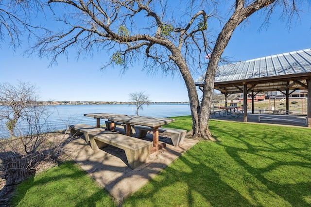 exterior space featuring a gazebo and a water view