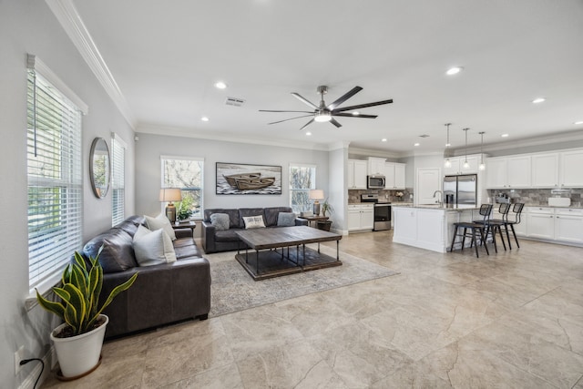 living room with crown molding, recessed lighting, visible vents, and ceiling fan