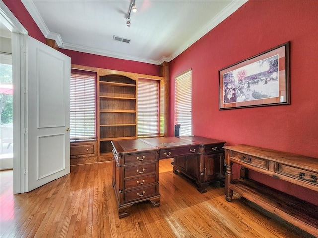 office with crown molding, rail lighting, visible vents, and light wood finished floors