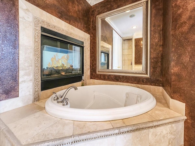 bathroom featuring a garden tub and ornamental molding