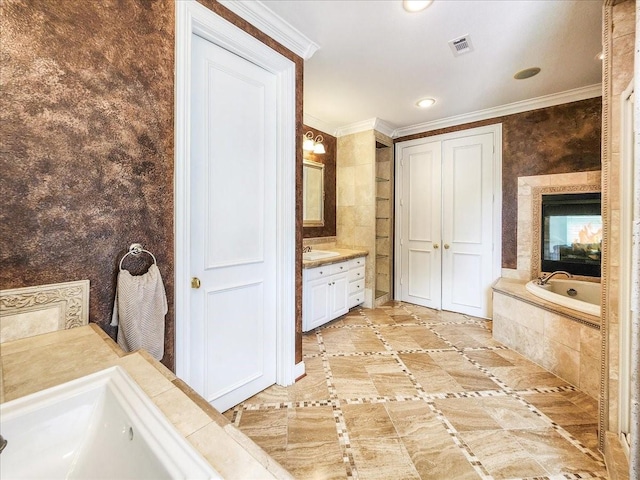 full bath featuring vanity, a garden tub, visible vents, recessed lighting, and crown molding