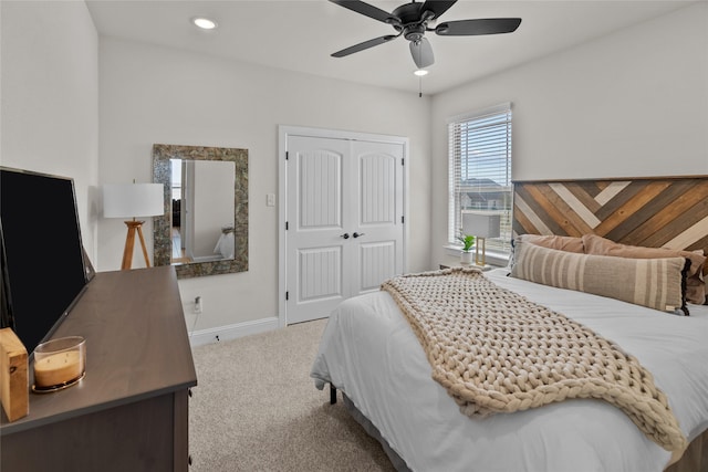 carpeted bedroom featuring a ceiling fan, recessed lighting, baseboards, and a closet