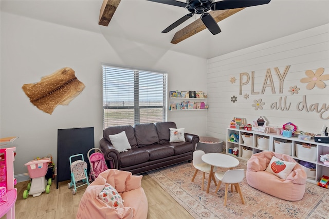 recreation room with a ceiling fan and wood finished floors