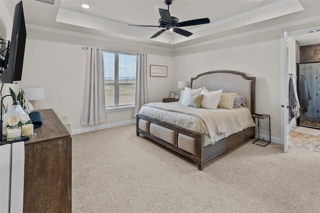 bedroom featuring a raised ceiling, crown molding, light colored carpet, and baseboards