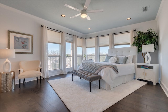 bedroom featuring baseboards, recessed lighting, dark wood-style flooring, ceiling fan, and ornamental molding