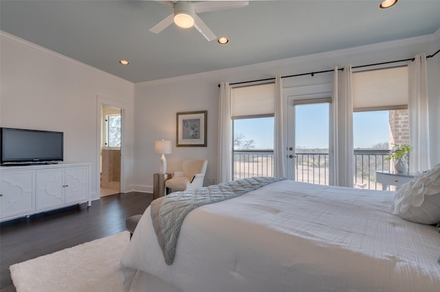 bedroom featuring multiple windows, dark wood finished floors, ornamental molding, and access to outside