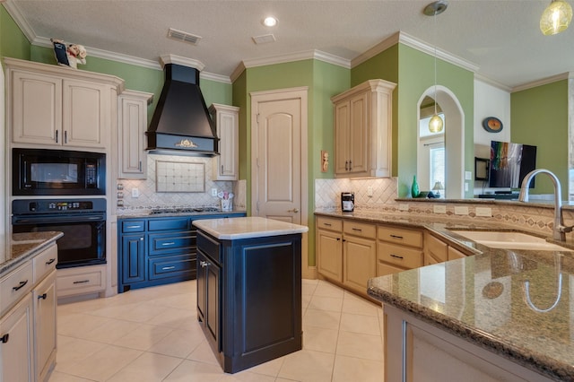 kitchen featuring premium range hood, visible vents, black appliances, a sink, and light tile patterned floors