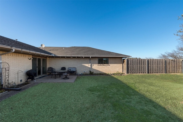 view of yard with a patio and fence