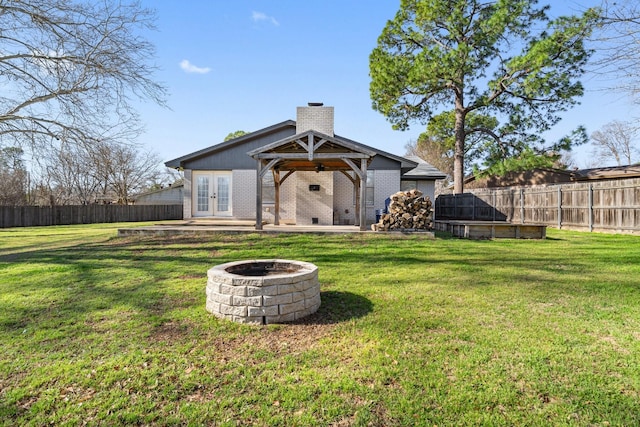 926 Harber Ave, Grapevine, TX 76051 - view of yard with french doors, a fire pit, ceiling fan, and a patio