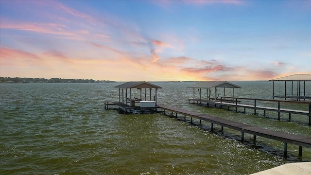 view of dock featuring boat lift and a water view