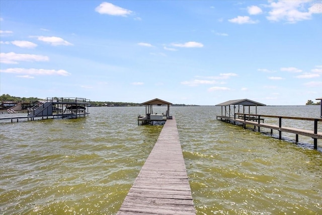 view of dock featuring a water view and boat lift