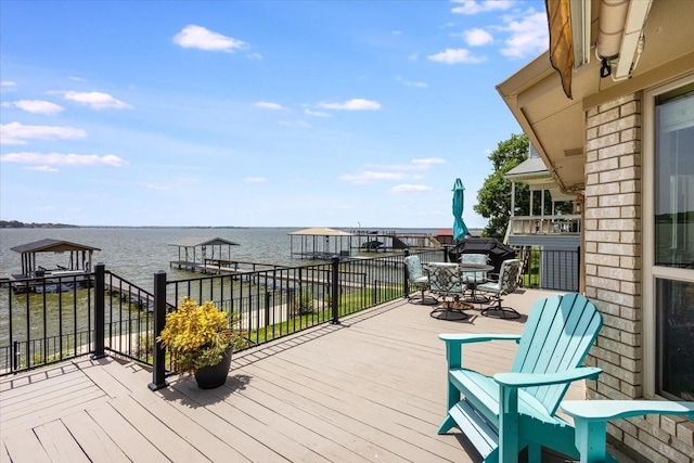 wooden deck with a water view