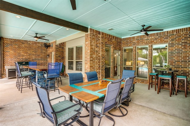 view of patio / terrace with outdoor dining space and ceiling fan