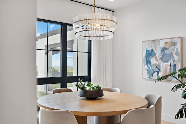 dining area featuring an inviting chandelier