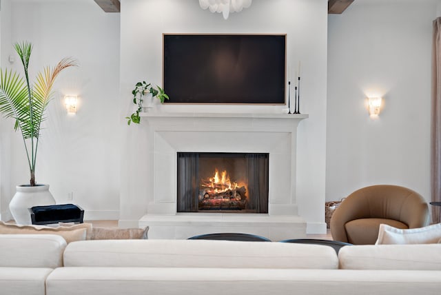 living area with a warm lit fireplace