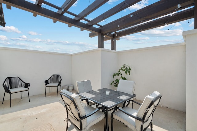 view of patio with outdoor dining space and a pergola