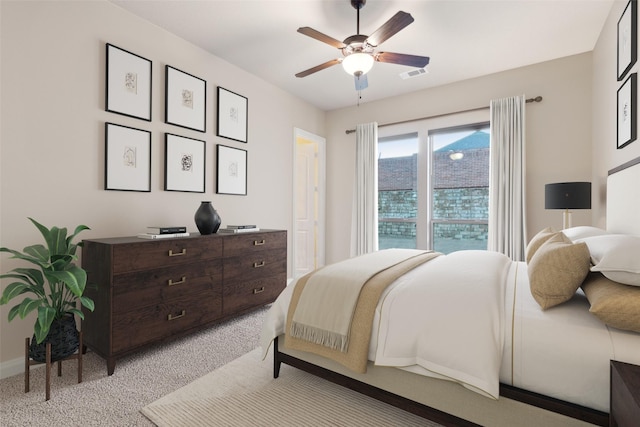 bedroom with a ceiling fan, visible vents, and light carpet