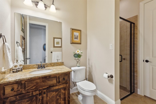 full bath featuring toilet, a stall shower, tile patterned flooring, baseboards, and vanity