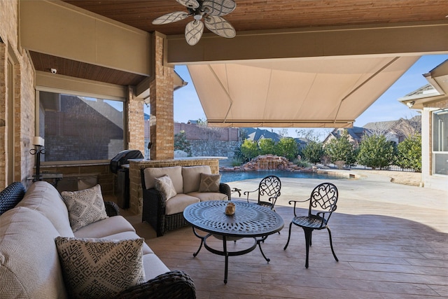 view of patio featuring ceiling fan, a deck with mountain view, and outdoor lounge area