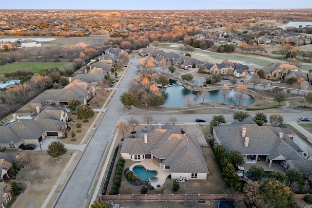 bird's eye view featuring a residential view and a water view