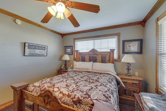 bedroom with ceiling fan and crown molding