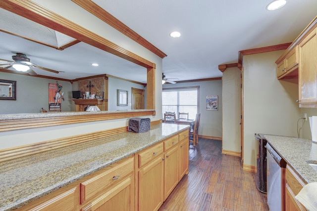 kitchen featuring wood finished floors, light stone countertops, recessed lighting, dishwasher, and crown molding