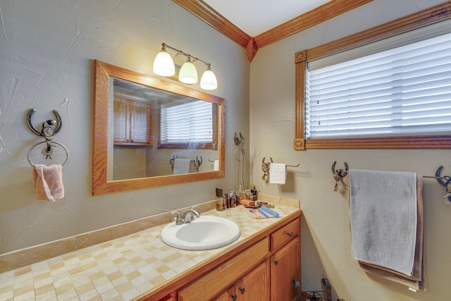 bathroom with vanity and ornamental molding