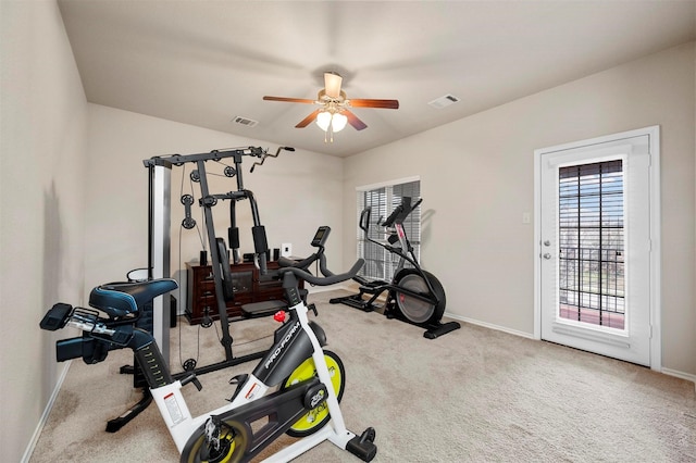 workout area featuring visible vents, baseboards, and carpet floors