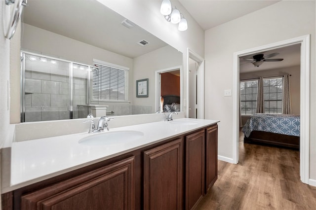 bathroom featuring a sink, visible vents, double vanity, and ensuite bathroom