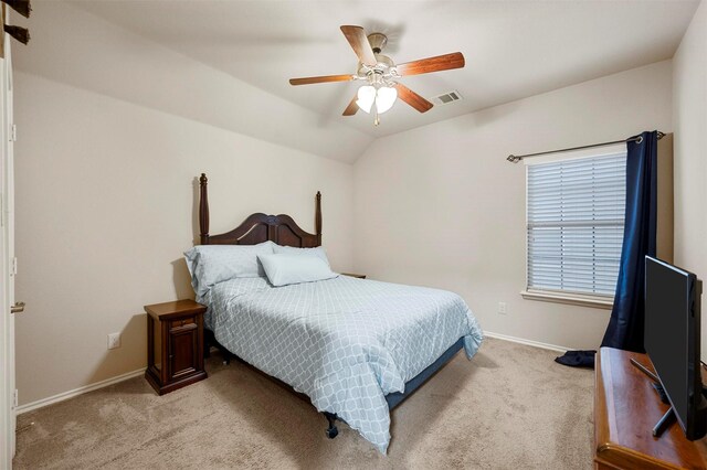 bedroom with visible vents, ceiling fan, baseboards, lofted ceiling, and light carpet