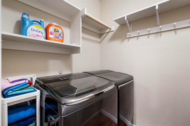 laundry area with laundry area and independent washer and dryer