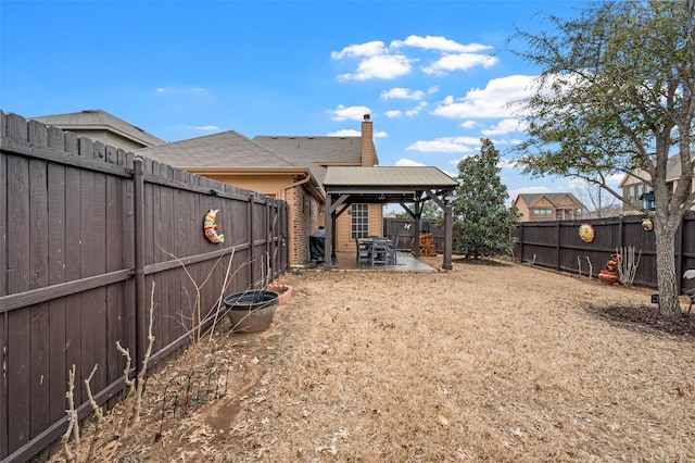 view of yard with a fenced backyard and a patio area