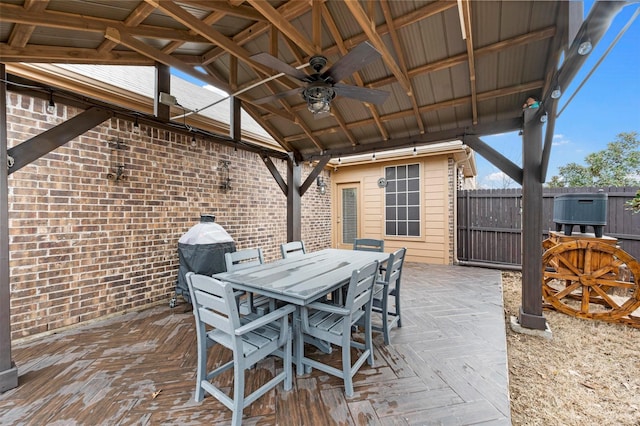 view of patio / terrace featuring outdoor dining area, a ceiling fan, and fence