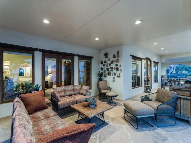 living area with recessed lighting and french doors