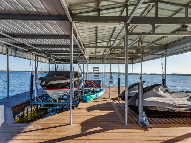 dock area featuring a water view and boat lift