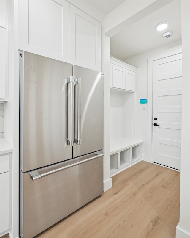 mudroom featuring visible vents and light wood-type flooring