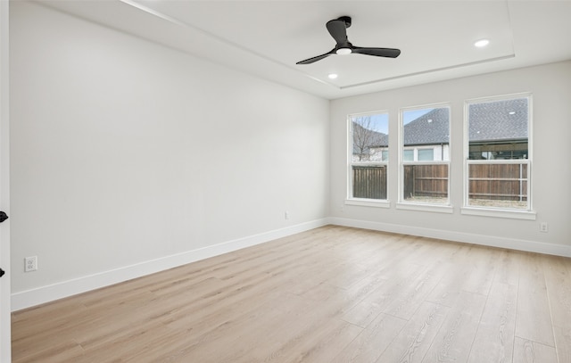 empty room featuring recessed lighting, baseboards, light wood-style floors, and a ceiling fan