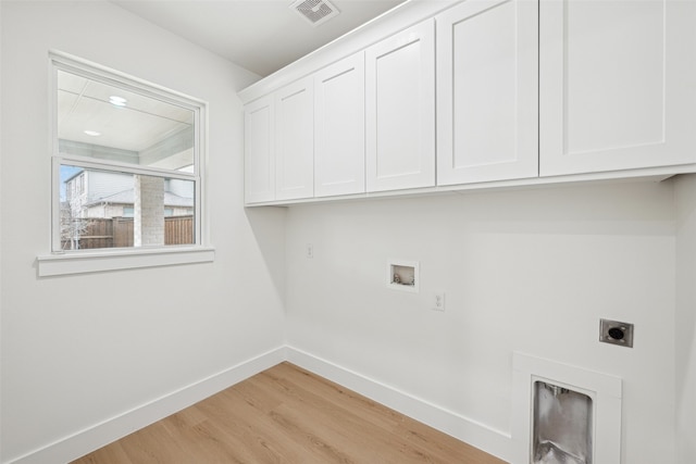 washroom with visible vents, baseboards, washer hookup, cabinet space, and hookup for an electric dryer