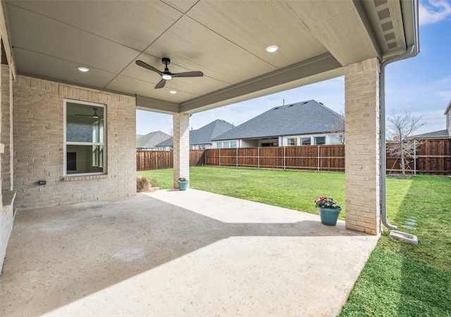 view of patio featuring a fenced backyard and a ceiling fan