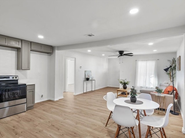 dining space featuring light wood-type flooring, visible vents, baseboards, and recessed lighting