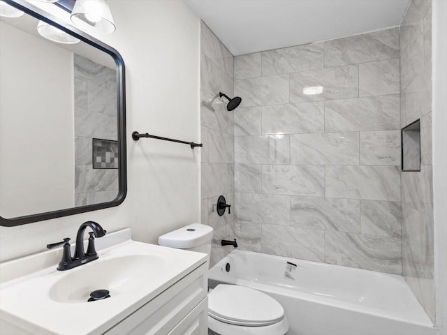 bathroom with vanity, toilet, and shower / tub combination