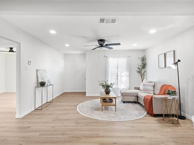 living area with visible vents, recessed lighting, ceiling fan, and wood finished floors