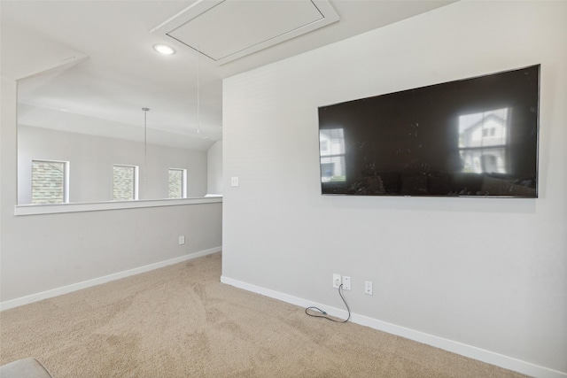 unfurnished room featuring recessed lighting, baseboards, carpet floors, and attic access