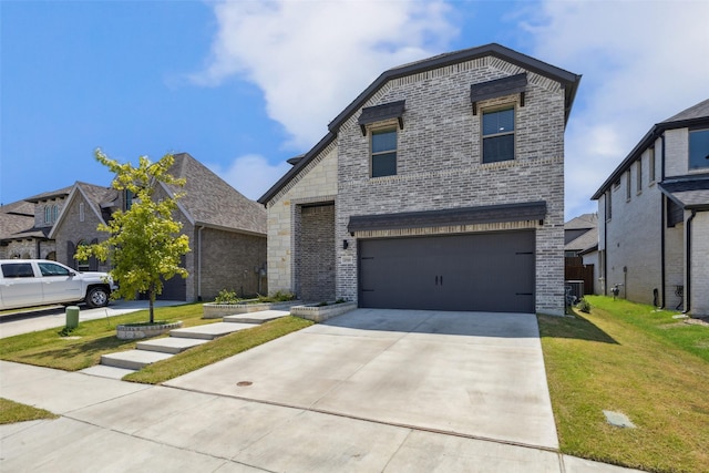 view of front of property featuring driveway, a front lawn, an attached garage, brick siding, and central AC unit