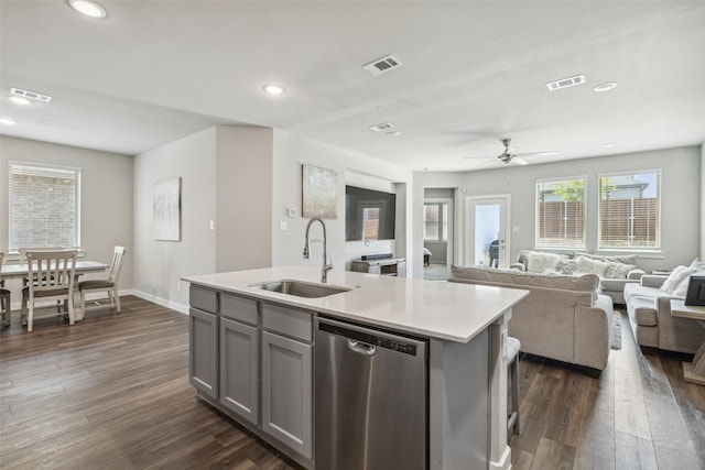 kitchen with dishwasher, visible vents, and a sink