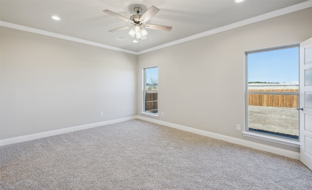 carpeted spare room featuring visible vents, a ceiling fan, recessed lighting, crown molding, and baseboards