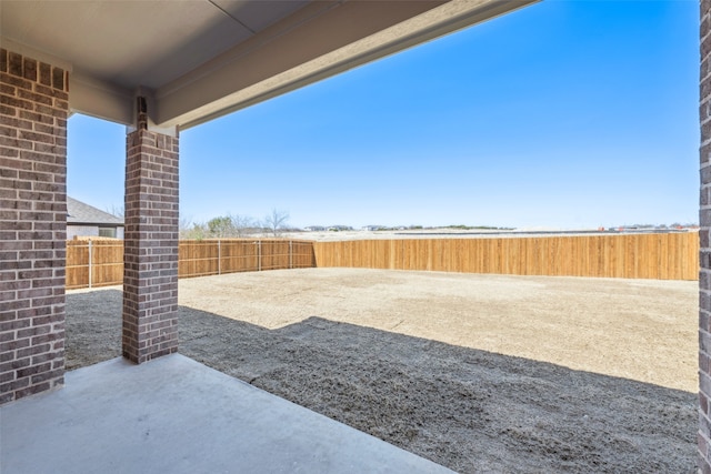 view of yard with a patio and fence