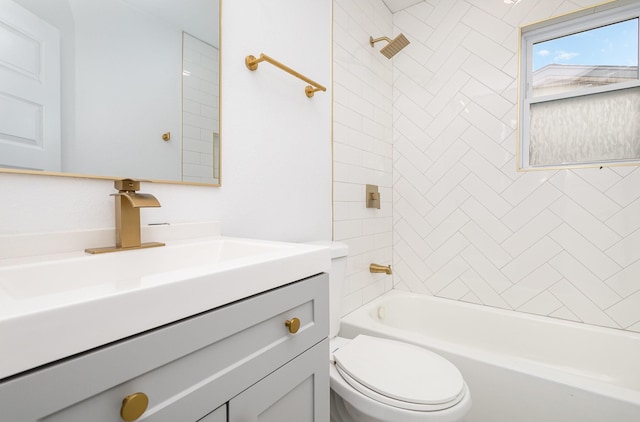 bathroom featuring vanity, shower / bathing tub combination, and toilet