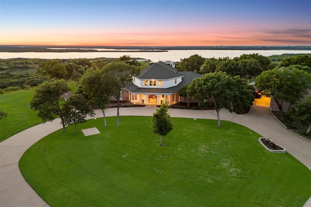 birds eye view of property featuring a water view